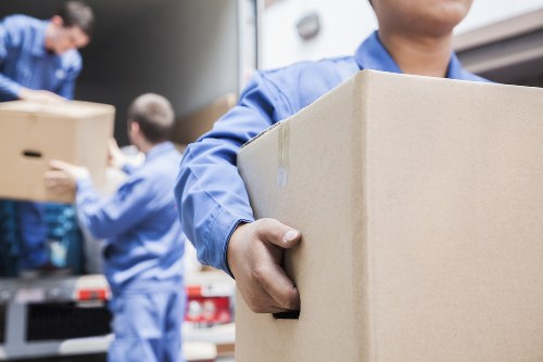 Professional movers loading boxes for a Shoreditch flat move
