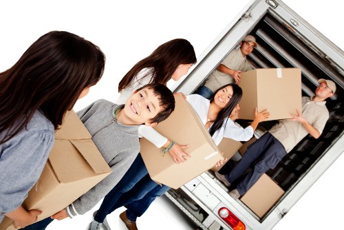 Local man and van removals service in Shoreditch with moving van and boxes