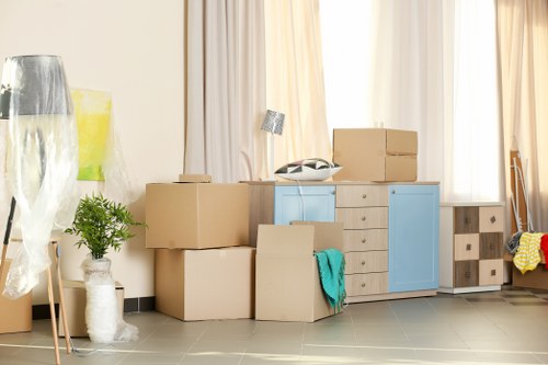 Removal team preparing for a move in Shoreditch with boxes and furniture