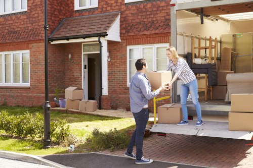 Staff assessing manual handling risks during a relocation