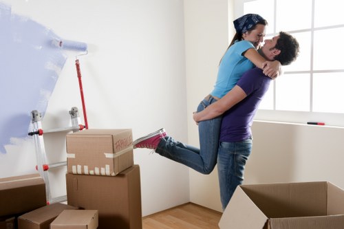 Professionals preparing desks and equipment for an office move