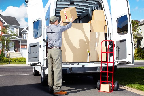 Removalists loading furniture from a Shoreditch apartment with careful handling
